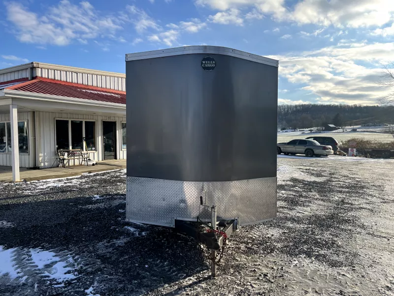 USED 2022 Wells Cargo 7X14 Enclosed Trailer 7000 GVW * SPARE TIRE * D-RINGS * .030 SCREWLESS EXTERIOR * 1PC ALUMINUM ROOF * UNDERCOATED