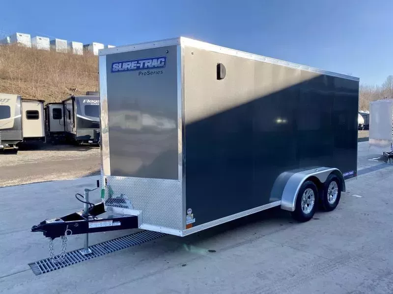 2026 Sure-Trac 7x16' Pro Series Enclosed Cargo Trailer 7000# GVW * CHARCOAL EXTERIOR * V-NOSE * RAMP * .030 SCREWLESS EXTERIOR * ALUMINUM WHEELS * 1 PC ROOF * 6'6" HEIGHT * 6" FRAME * 16" O.C. C/M * PLYWOOD * TUBE STUDS