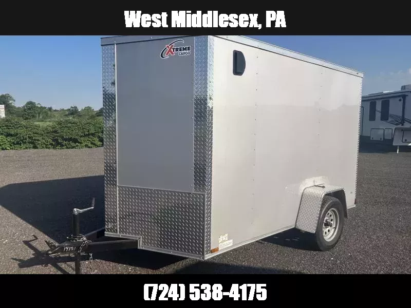 2025 Xtreme Cargo 6x10' Enclosed Cargo Trailer 2990# GVW * 6'3" HEIGHT * 16" FLOOR CROSSMEMBERS * WHITE EXTERIOR * .080 POLYCOR SEMI-SCREWLESS * RV DOOR * PLYWOOD WALLS AND FLOOR * TUBE STUDS 1751902653