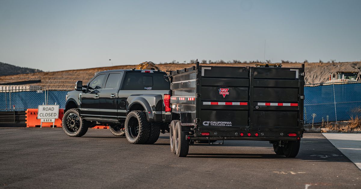 A used dump trailer at the California Trailers sales lot. " width="1200" height="630