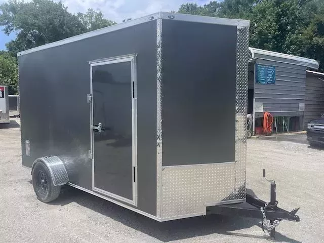 6x12 Enclosed Trailer 7 Foot Interior Height .080 Poly Skin One Piece Aluminum Roof 2 Way Side Vents, 4 D Rings W/ Side Door Barlock & Flushlock & Ramp 2025